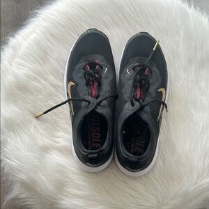 Ace golf shoes for women by Nike.